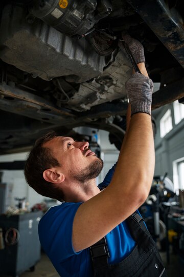 male mechanic working car auto repair shop in Baltimore